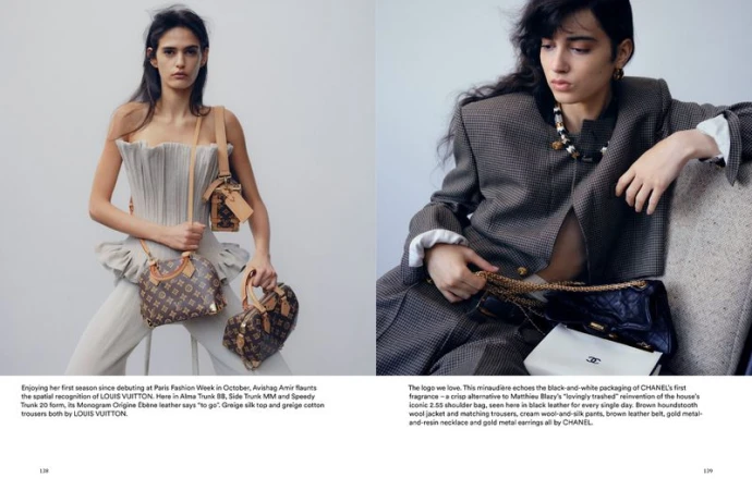 Two fashion models showcase Louis Vuitton handbags in a studio, wearing stylish clothing and accessories against a plain backdrop.