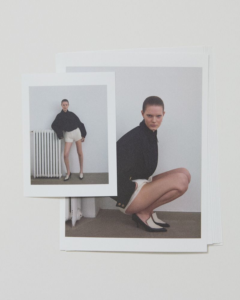 Two fashion photos show a young adult woman in dark shirt and light shorts posing in an indoor setting. One photo is closer, one is full length.