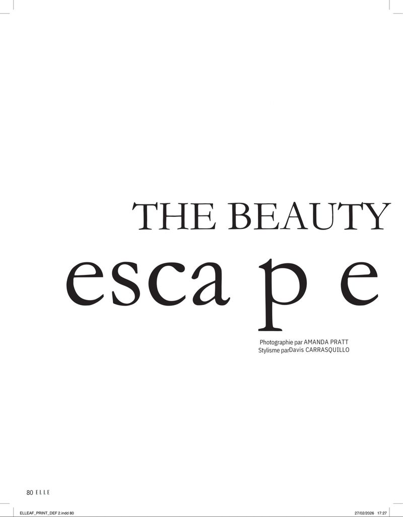 Magazine spread featuring the words 'THE BEAUTY escape' in a bold, graphic sans-serif font on a stark white background.