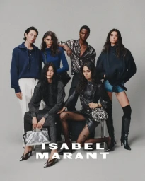 Group of six fashion models posing together against a grey studio backdrop for Isabel Marant AW26 collection.