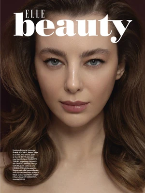 Close-up beauty portrait of a woman with voluminous brown hair and natural makeup for Elle Bulgaria photographed by David Garcia