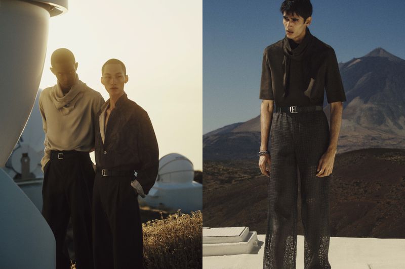 Two adult male fashion models pose outdoors near an observatory, wearing casual smart clothing in front of a mountain landscape on a sunny day.