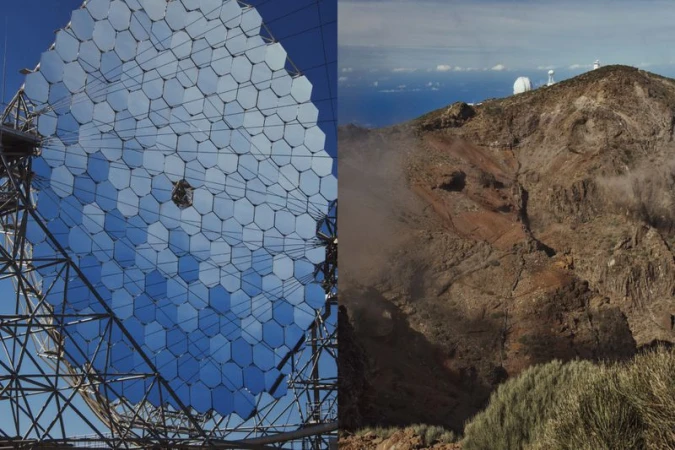 Large array of hexagonal mirror panels in a solar power installation, contrasted with a mountain peak and distant white dome structures.