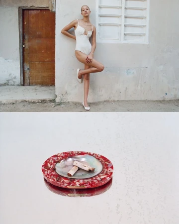 A slender model poses in a white bodysuit and ballet flats against a textured wall, with a decorative ashtray in the foreground.