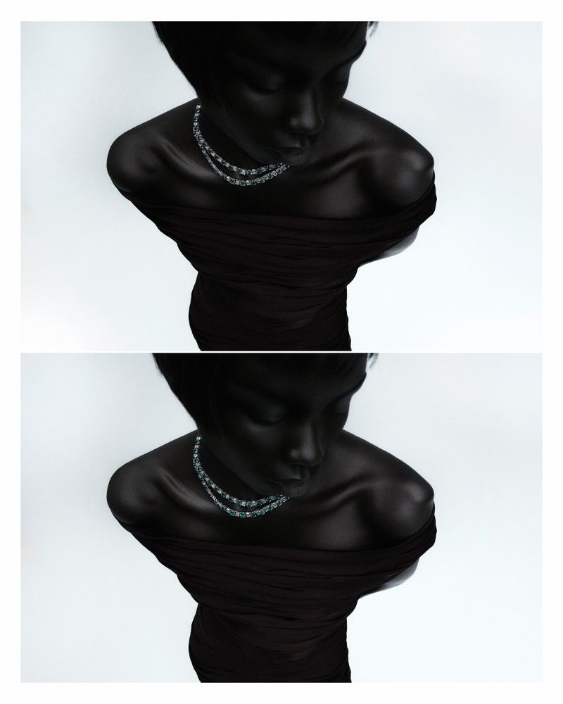 Overhead studio shot of a Black female adult wearing a draped black dress and a two-strand necklace against a gradient white backdrop.