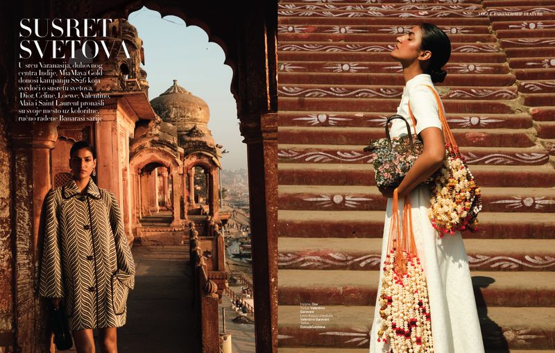 Editorial fashion shot of two South Asian women in India. One wears patterned coat by a stone structure; the other wears a white dress on stairs.