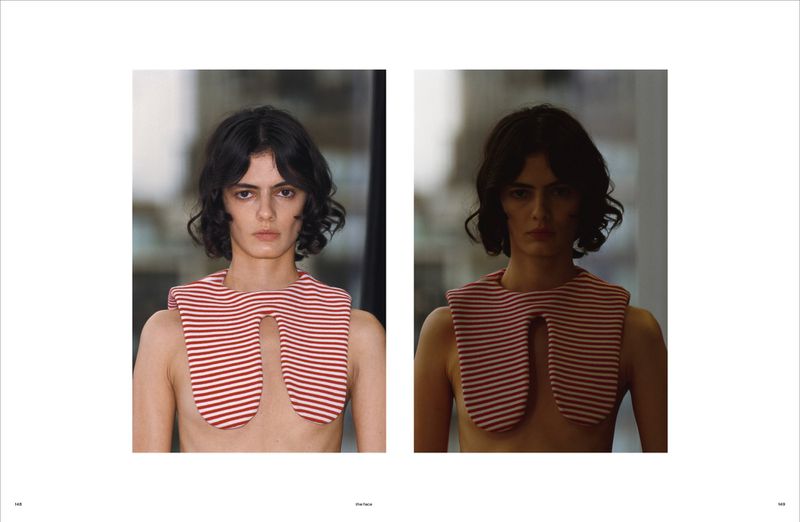Fashion shot of a woman with dark wavy hair and a red and white striped bib-like garment, captured in a studio setting with soft lighting.