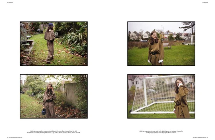 Fashion editorial featuring a young woman in a brown jacket and pants, posing in an outdoor grassy setting with trees and houses.