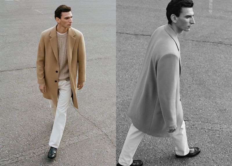 A man walks across asphalt in a tan coat, beige sweater, and white jeans, split with a black-and-white version of the image. 