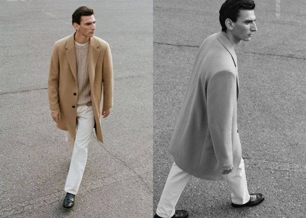 A man walks across asphalt in a tan coat, beige sweater, and white jeans, split with a black-and-white version of the image. 