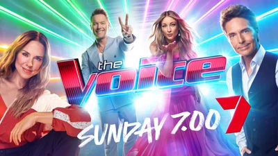 Four judges posing on set against a glowing neon background with the Voice logo for Channel 7 by Peter Brew-Bevan.