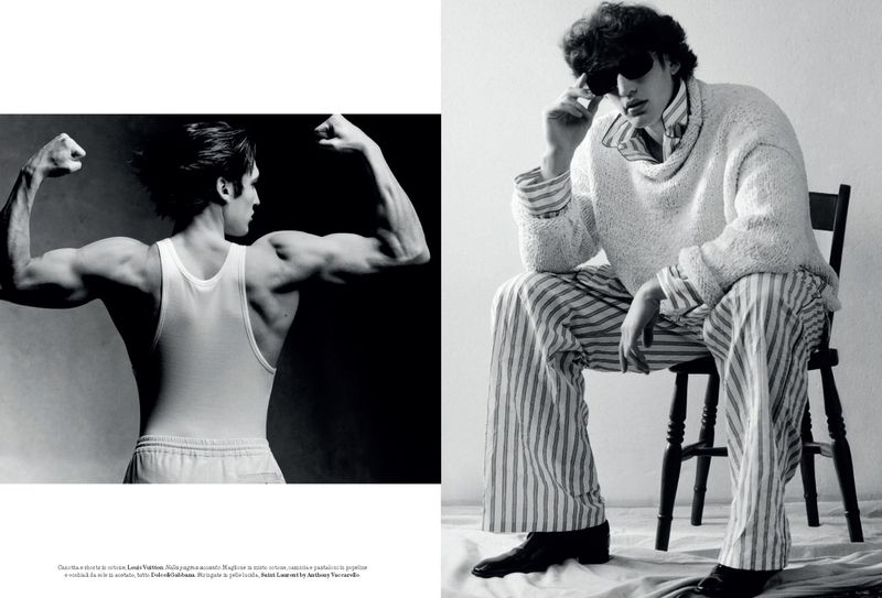 Black and white fashion photography featuring two stylish men in different outfits, one flexing his muscles, the other seated in striped pajamas.