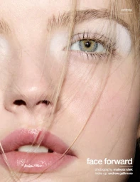 Close-up beauty portrait of a woman with blonde hair across her face, glossy pink lips, and white eyeshadow for Schön! Switzerland