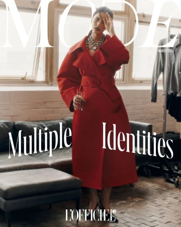 Magazine cover featuring a woman in a red coat, jewelry, and heels, holding a glass bottle, with the title "MODE" and "Multiple Identities."
