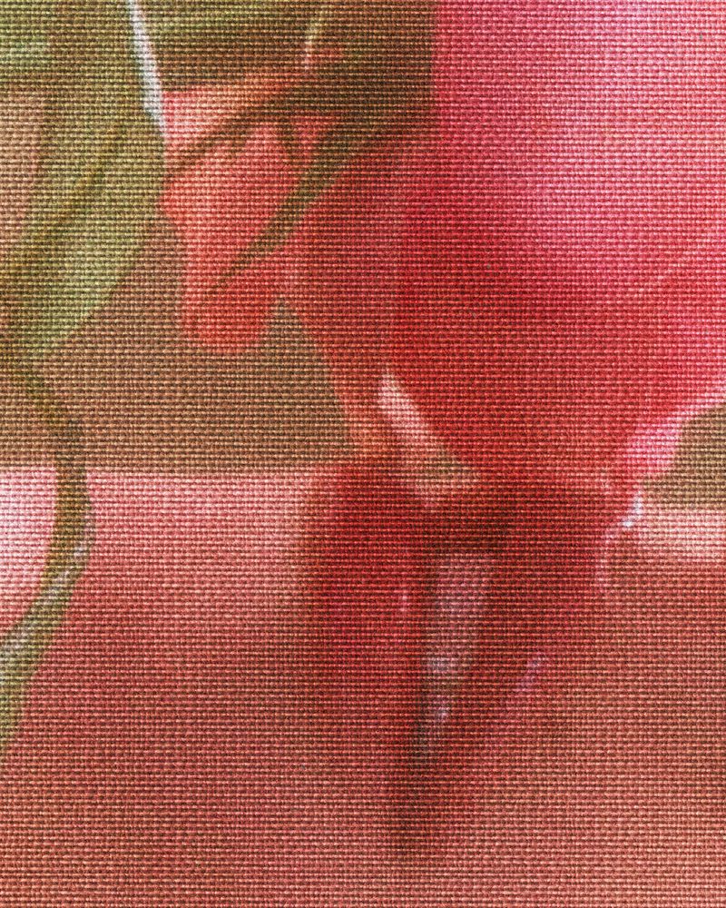 Macro photo of floral fabric with pink petals and green leaves, showcasing a detailed textile texture and vibrant color palette.