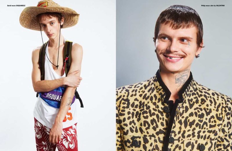 Two male models in a fashion spread, one wearing a straw hat and tank top, the other in a leopard print jacket.