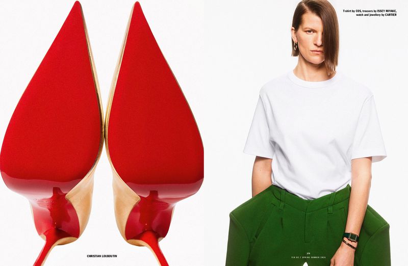 Close-up studio shot of high heel shoes with red soles alongside a woman wearing a white t-shirt and green trousers in a studio.