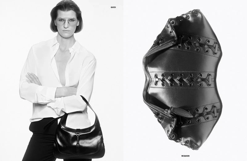 Monochrome fashion shot of a woman in a white shirt holding a black leather purse, next to a black leather accessory.