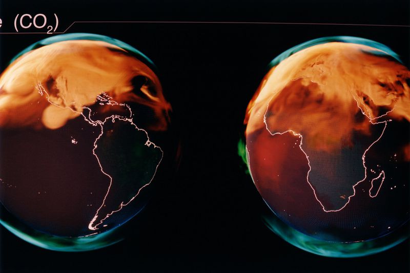 Earth models show land masses and orange atmospheric effects on a black background, illustrating climate or weather patterns.