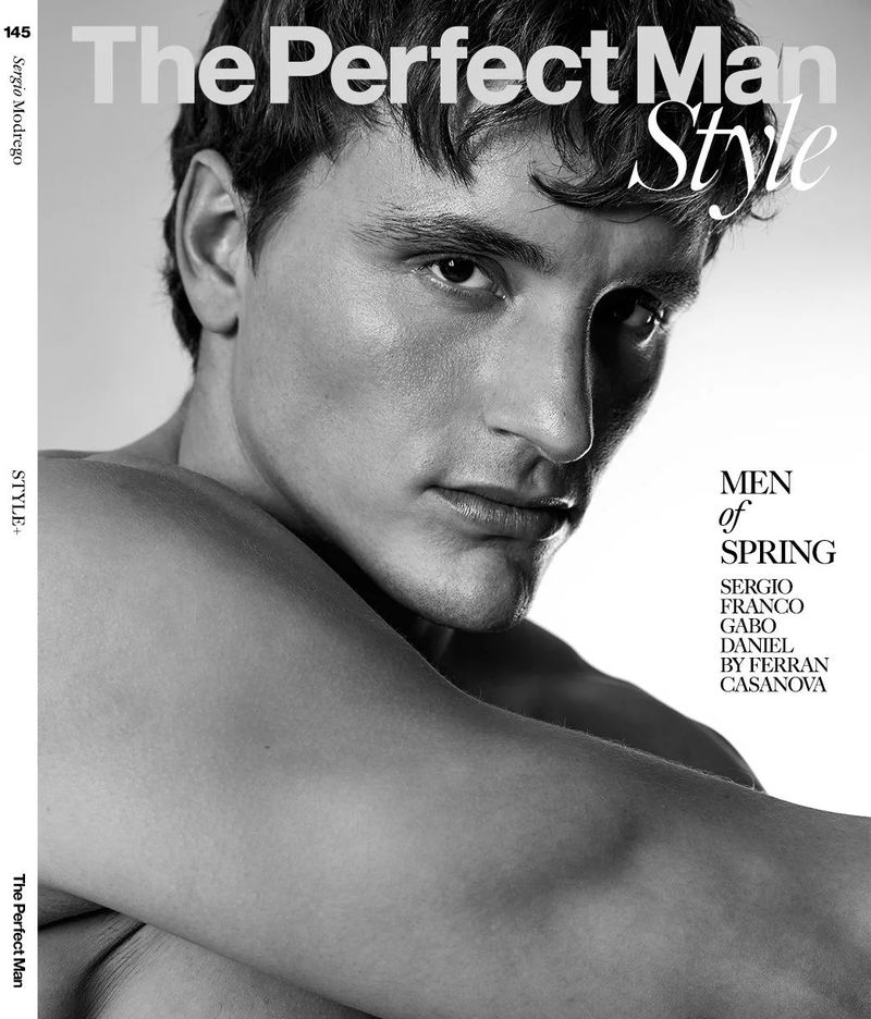 Portrait of a shirtless adult male model in black and white with visible text overlay for 'The Perfect Man' magazine cover.
