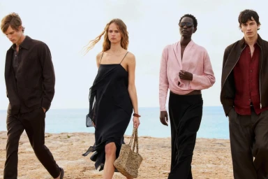 Four models walking along a sandy coast with ocean backdrop for Massimo Dutti La Playa S/S 26 fashion campaign.