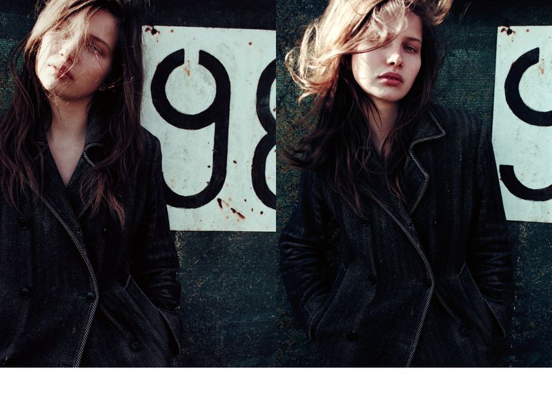 A split portrait of a young fair-skinned woman with long brown hair wearing a dark coat posing in front of a sign with the number 98.