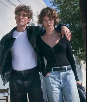 Two models wearing denim and jackets outdoors against an urban background for Calvin Klein Denim Spring 2026 campaign.