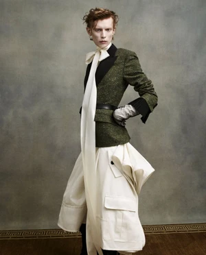 Model Owen Ruppersburg in olive green tweed blazer and white utility skirt by Icon America, photographed by Solve Sundsbo.