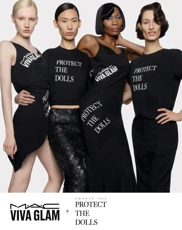 Four diverse women in black dresses and t-shirts pose for a fashion advertisement with MAC Viva Glam and Protect The Dolls branding.