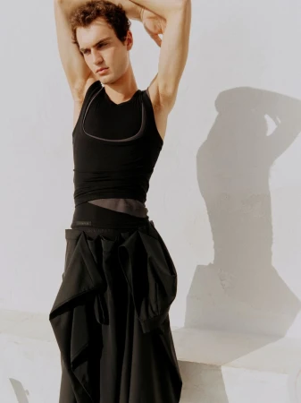 Model Lars Jammaers wearing black apparel posing against a plain wall for The Greatest Magazine Issue 29