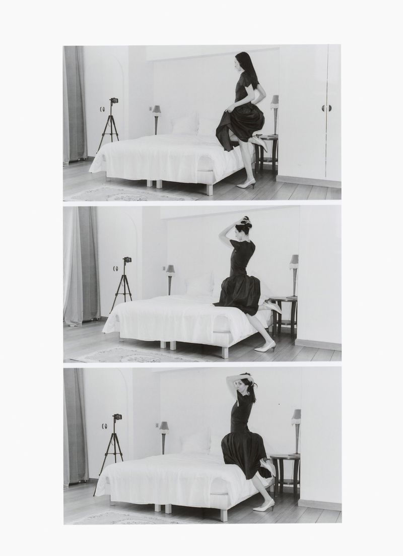 Three frames of a woman in a black dress posing in a minimalist bedroom. The first shows her stepping onto the bed, the second her adjusting her hair.