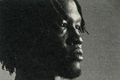 Monochrome portrait of a black man in profile with textured grain for 321 Magazine Heaven Issue