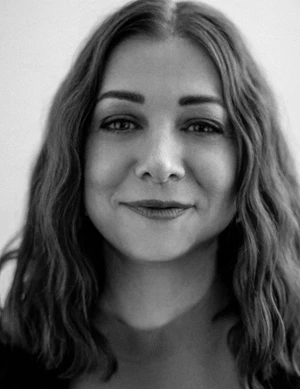 Portrait of actress Alyson Hannigan with wavy brown hair looking forward in monochrome