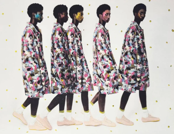 Fashion editorial shot with five young adult women walking in a line wearing matching colorful patterned coats, dark leggings, and light pink shoes.