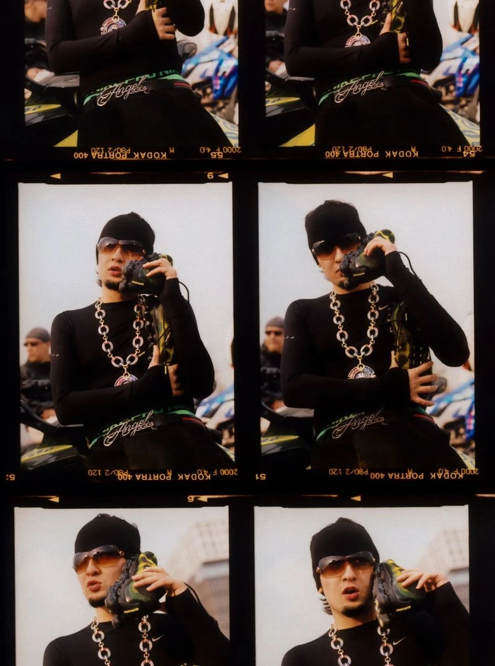 Contact sheet of film frames showing a man in a black beanie, sunglasses, and chunky chain holding a sneaker to his ear like a phone.