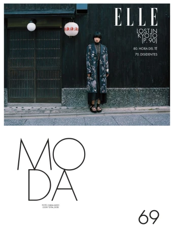 Fashion editorial cover of Elle magazine featuring a female model in a floral coat standing in front of a traditional Japanese building.