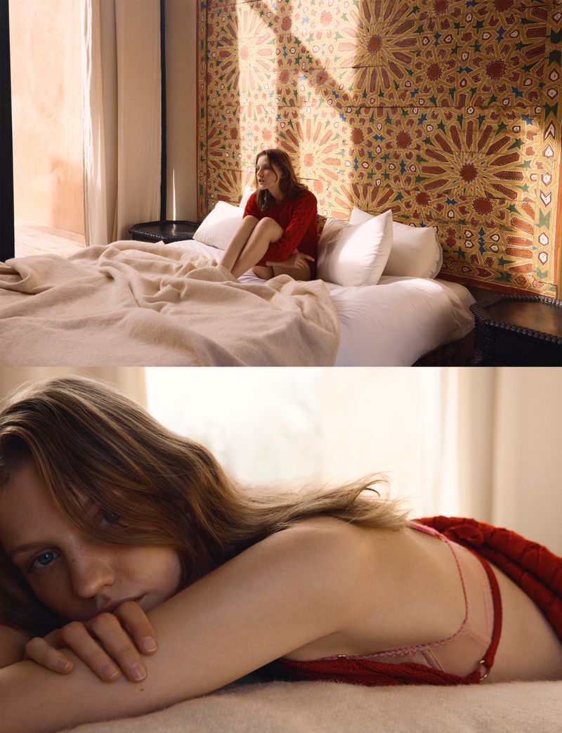 Model resting on a white bed against an ornate patterned headboard for Vogue Thailand editorial