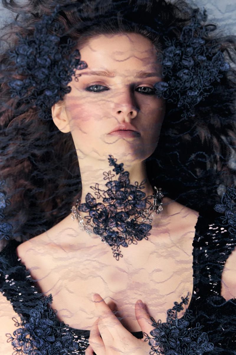 Model wearing dark lace veil and black dress for Elle Lithuania editorial by Anastasia Fursova