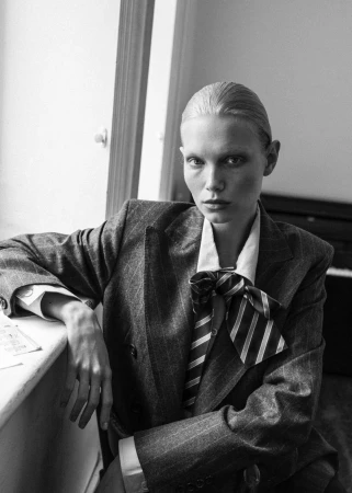 Model Sasha Dom wearing pinstripe blazer and striped necktie in The Composer editorial for 5ELEVEN Magazine by photographer Edwin S Freyer.