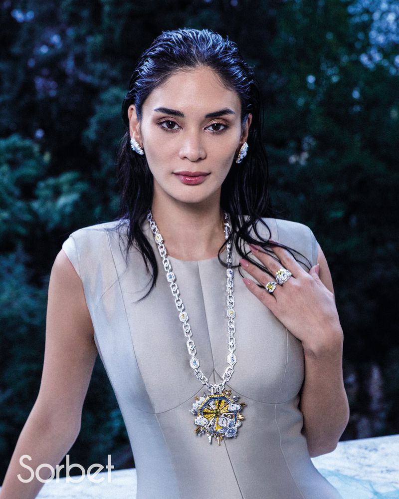 Woman wearing a grey dress and diamond pendant necklace in Sorbet Magazine editorial for Pia Jauncey