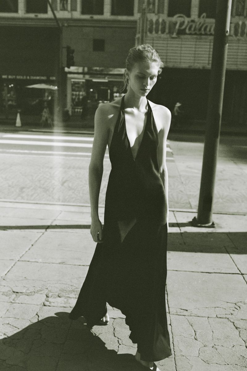 Model wearing a black halter dress walking on a city street for Zara Women Spring 2026 campaign.