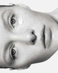 Close-up monochrome portrait of a model with skincare cream near her eye for Instytutum shot by Serhii Vasyliev.