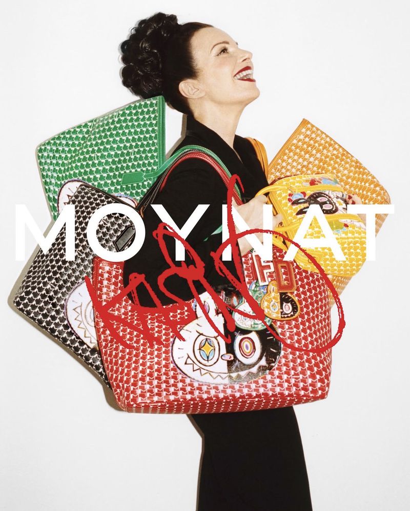 Elegant woman with black hair holds multiple vibrant designer bags, showcasing a fashionable and artistic visual statement with a joyful mood.