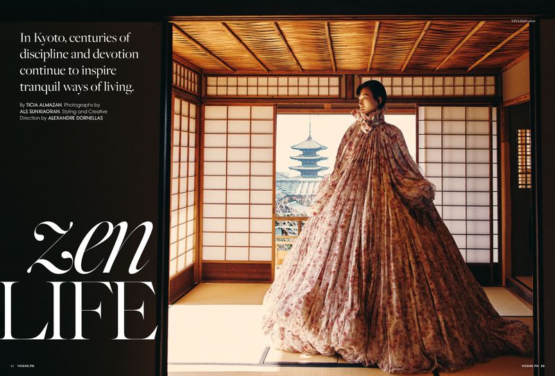 Model wearing a voluminous floral dress standing inside a traditional Japanese interior with shoji screens