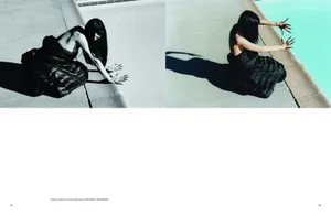 Model in black jacket with long dark hair and long nails kneeling by a swimming pool edge for Pop Magazine editorial