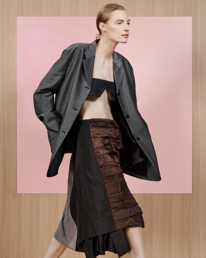 Model Julia Nobis in a grey blazer and brown paneled skirt for Financial Times HTSI Magazine