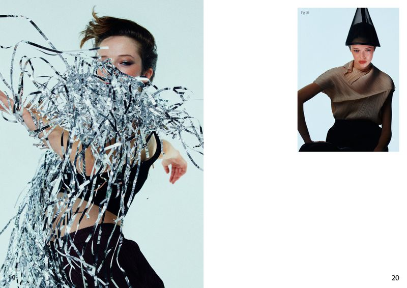 Model covered in falling silver metallic ribbon shards against a clean light background for Duel Magazine project Waiting Time.