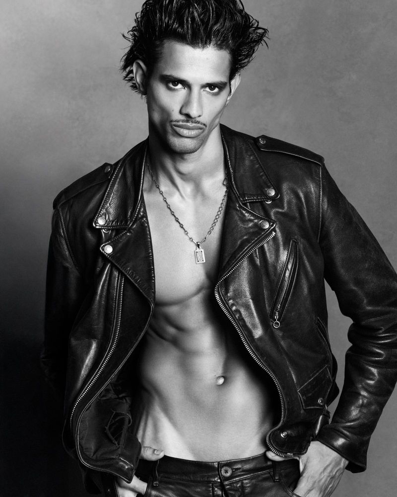 Monochrome portrait of male model Jonas Barros wearing a leather jacket for Double Vision by Luigi and Iango.