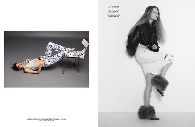 Two female models posing in a fashion spread for Pop Magazine with editorial clothing against a plain studio background.
