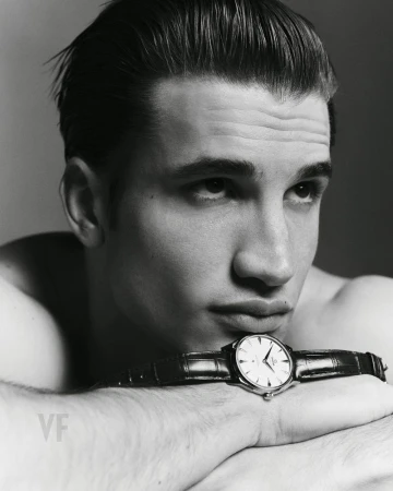 Close-up portrait of model Max Knott wearing a leather wrist watch for Vanity Fair Italia, photographed by Zeb Daemen